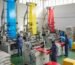 Modern plastic manufacturing facility in Nigeria with advanced machinery and workers in action